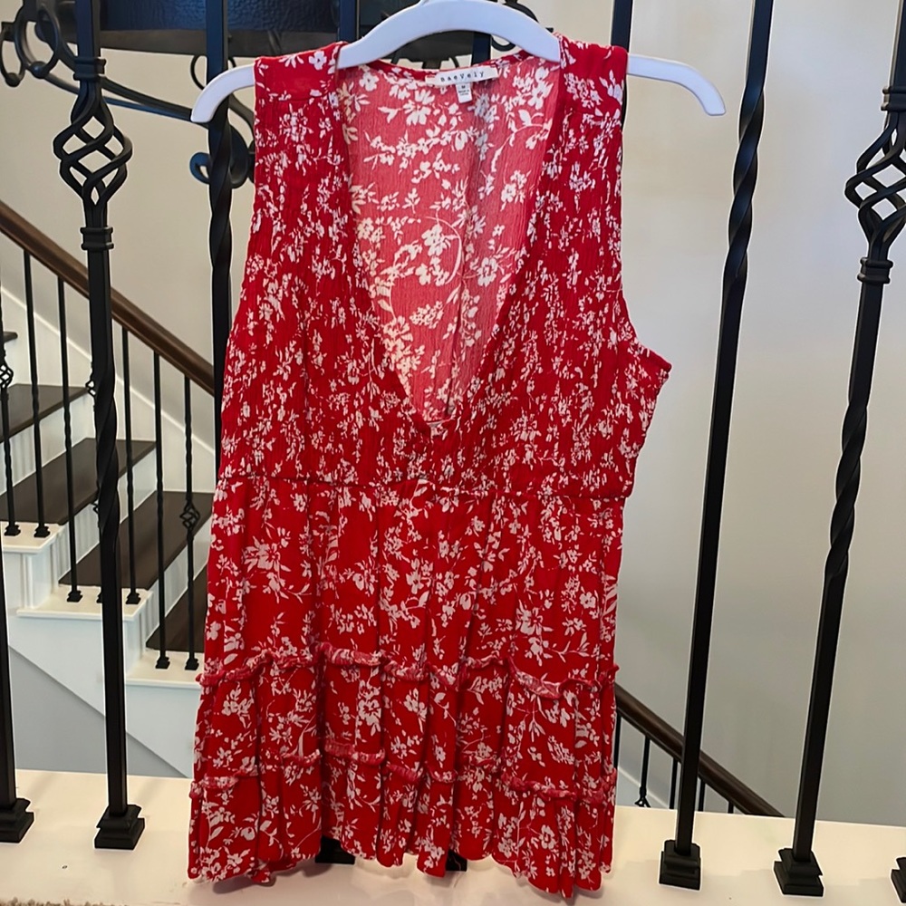 Red, flowy, low cut tank top.